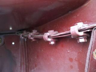 Passenger side tank clamps