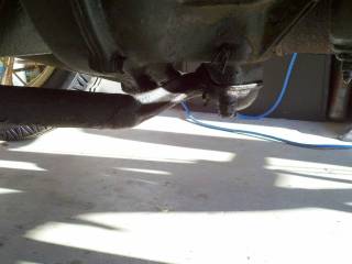 Front suspension link to tranny