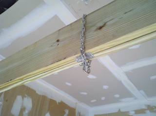 A chain hanging over a beam...